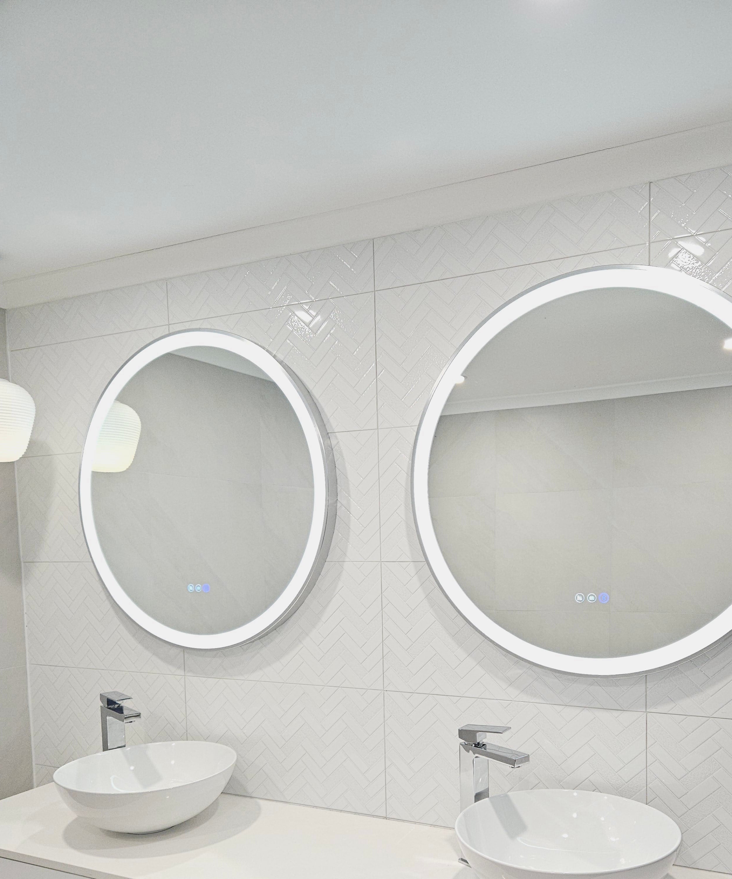 InVogue Mirrors' Silver Frame Circle Smart LED Mirrors Adding Style to All-White Bathroom