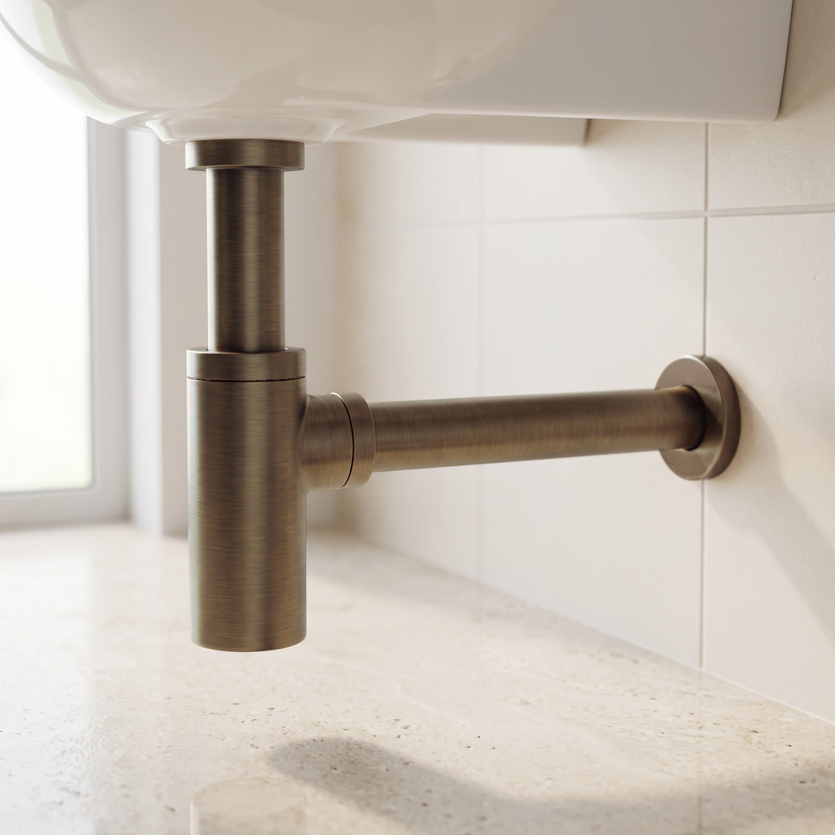 Firenze Basin Bottle Trap in Antique Brass in a bathroom