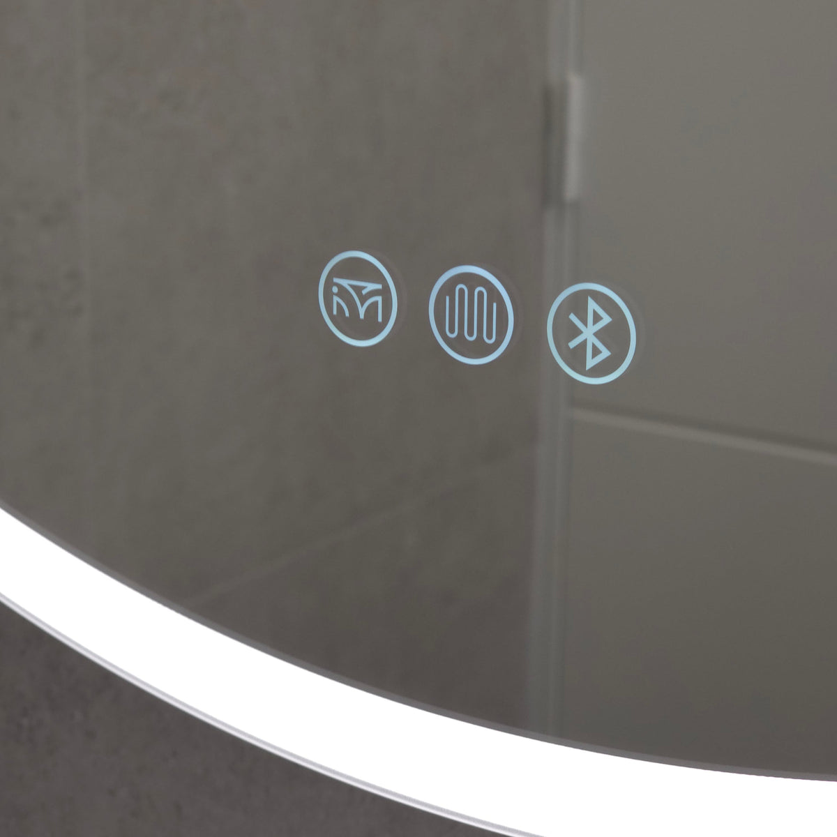 Close up view of touch buttons on round frameless LED mirror cabinet