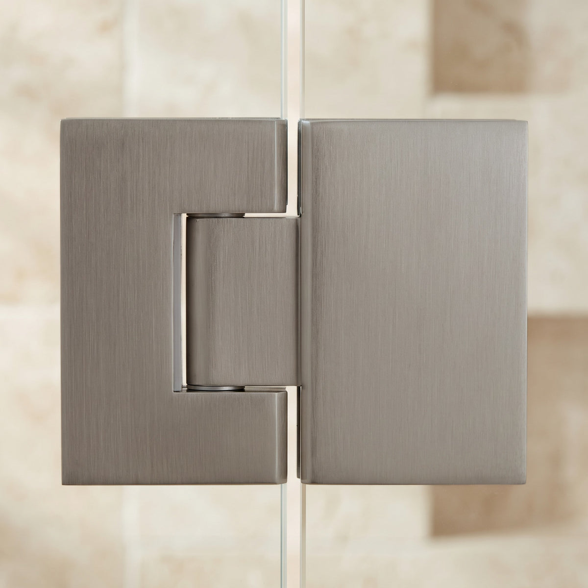 Close-up of the Geneva Shower Hinge Glass to Glass in Brushed Nickel
