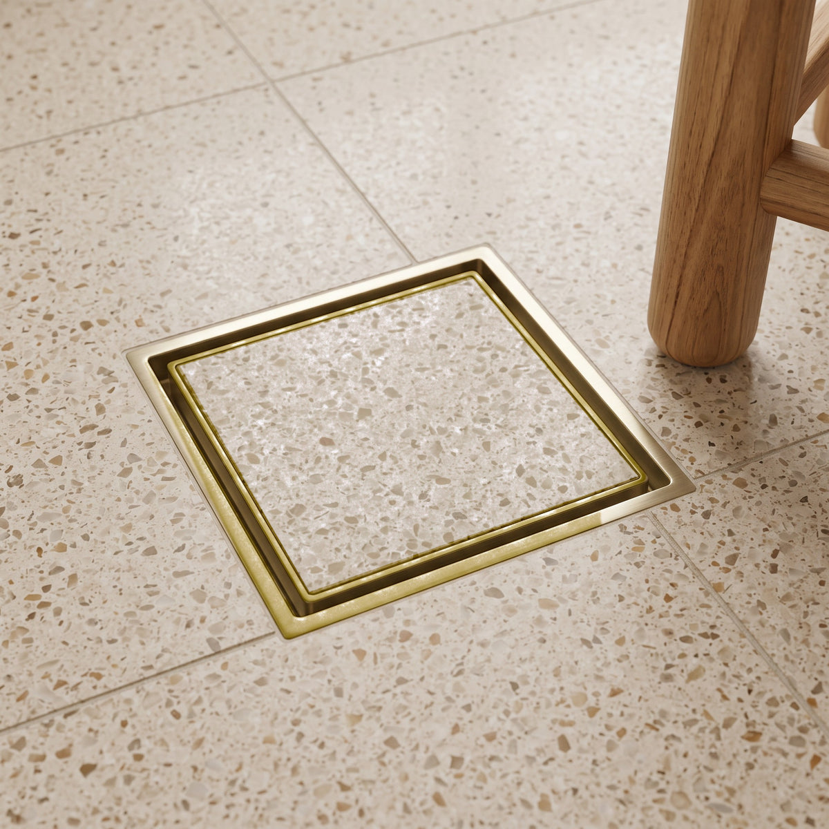 Granada Tile Insert Floor Waste in Brushed Brass in a shower
