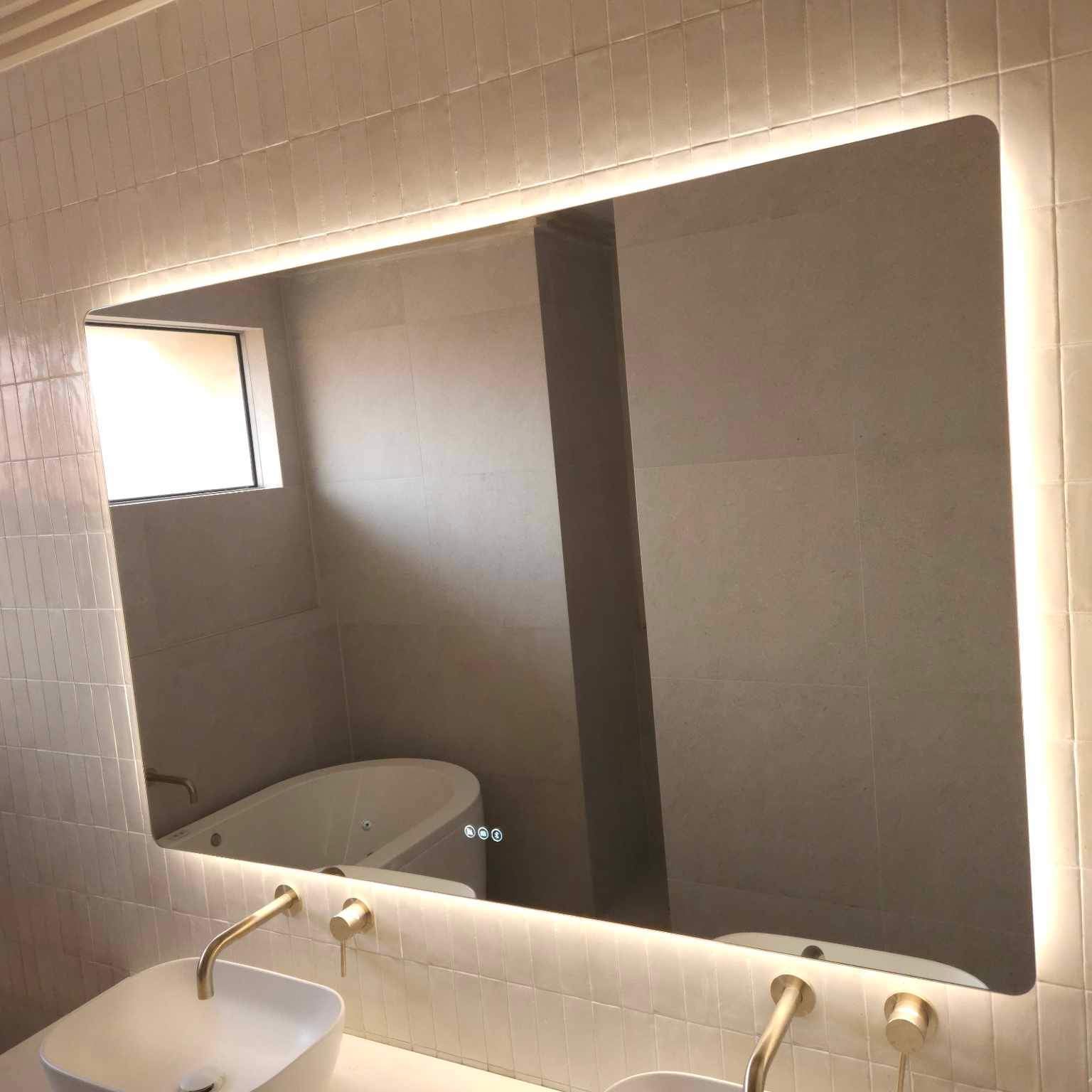 Spacious Gold, Beige, and White Themed Bathroom with Large Smart Backlit LED Mirror