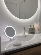 Circle Backlit Mirror on White Wall, LED Mini Make-Up Mirror, and Small Circle LED Mirror on Vanity