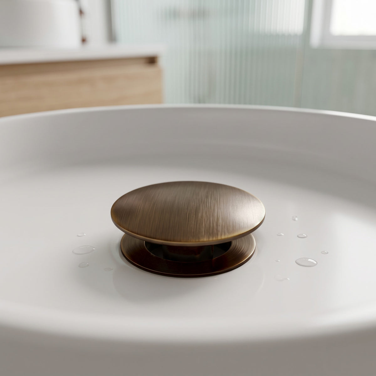 Close-up of the Lisbon Pop Up Basin Waste in Antique Brass