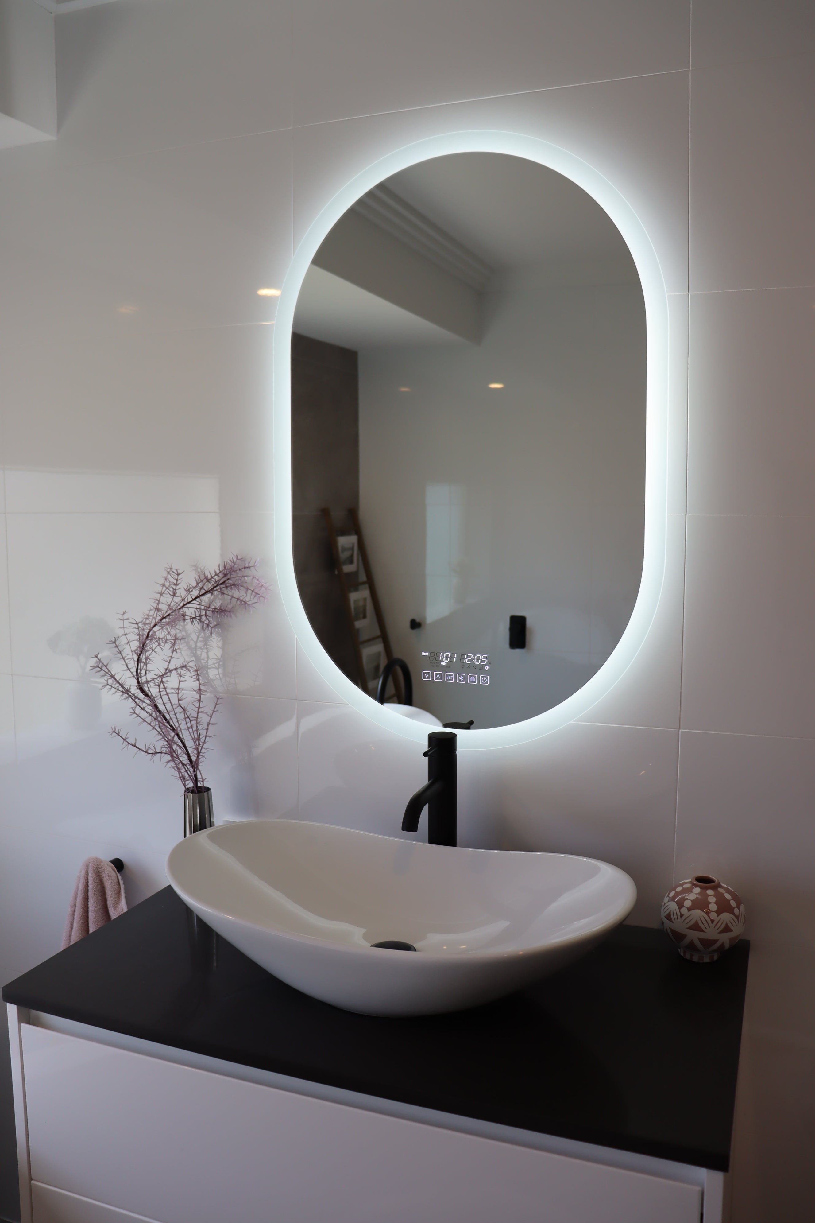 Oval Smart LED mirror illuminates the bathroom in the absence of main lights