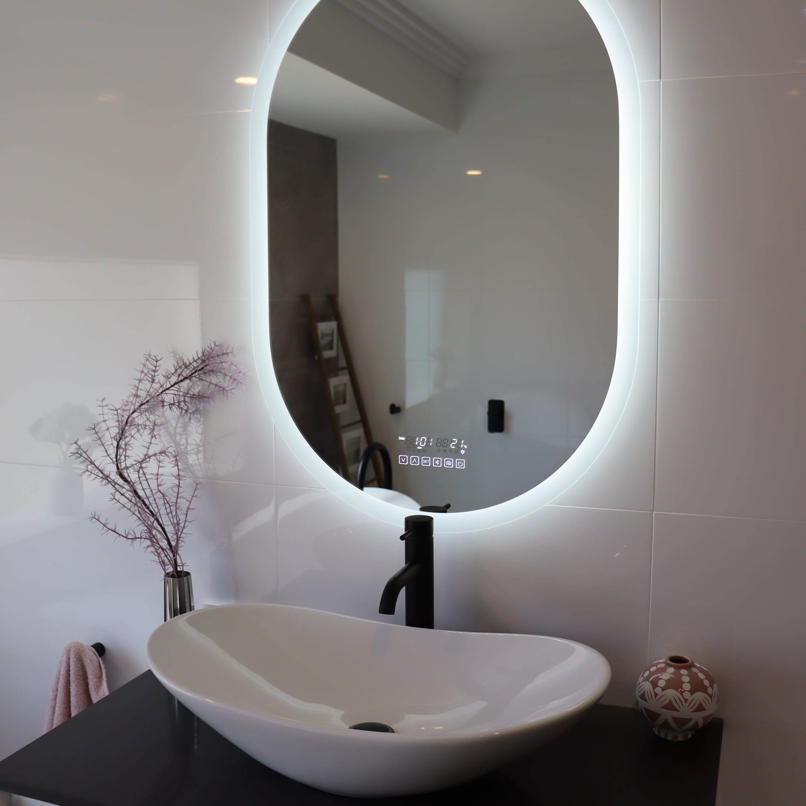 Oval Smart LED mirror illuminates the bathroom in the absence of main lights