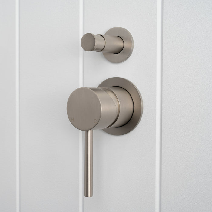 Cannes Shower Diverter and Mixer in Brushed Nickel, three-quarter view of diverter and lever, white vertical-panelled wall
