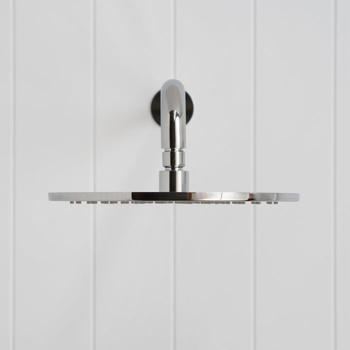 Bordeaux Wall Mounted Shower Head with Arm in Chrome, front view on a white vertical-panelled wall