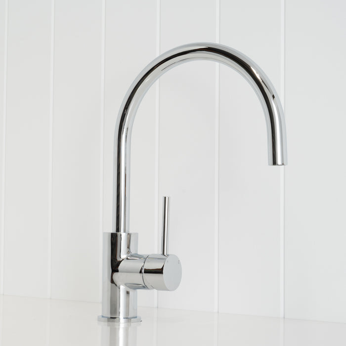 Como Kitchen Mixer Tap in Chrome, three-quarter front view on a white vertical-panelled wall