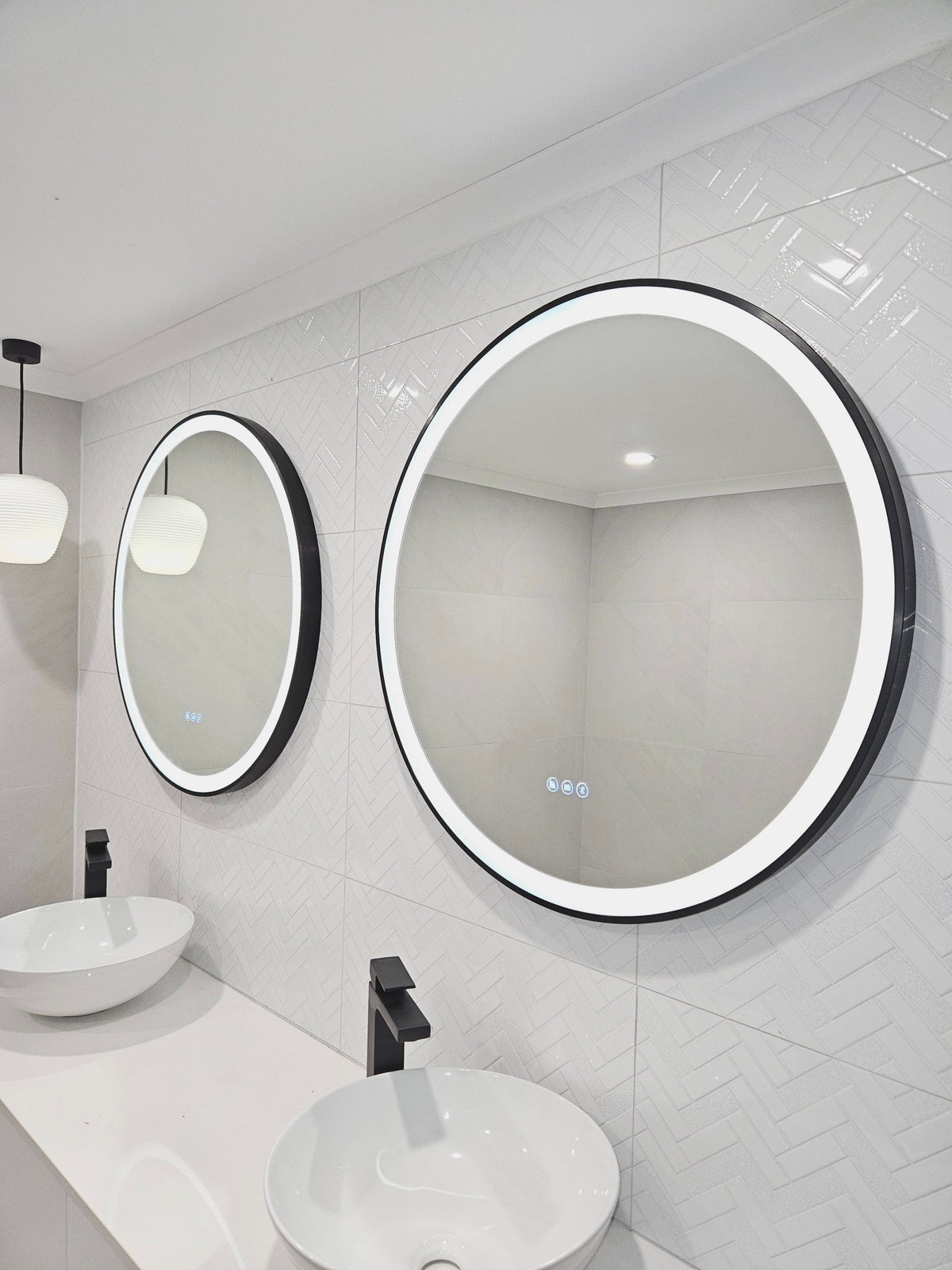 Low Angle Right-Side Perspective of the Vanity Area in White and Grey Bathroom with Black Accents