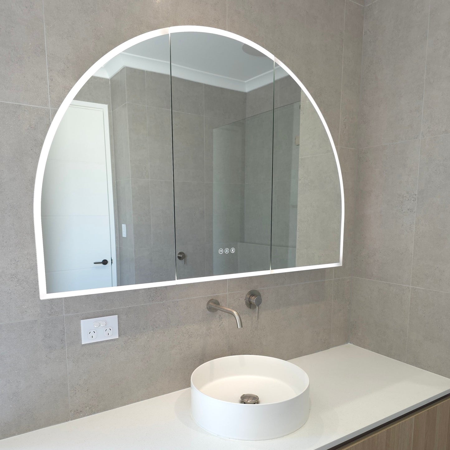 Exterior view of frameless LED mirror cabinet with demister