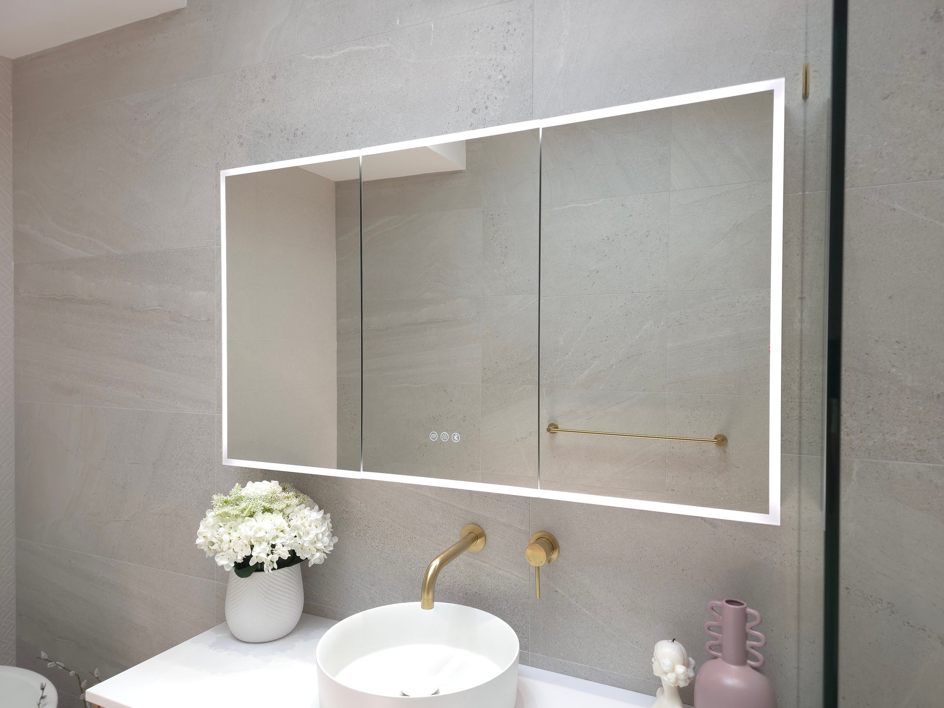 Outside view of frameless LED mirror cabinet with exterior light