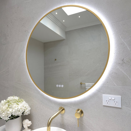 Angled view of the Bellagio gold frame showing how it wraps around the edge of the glass