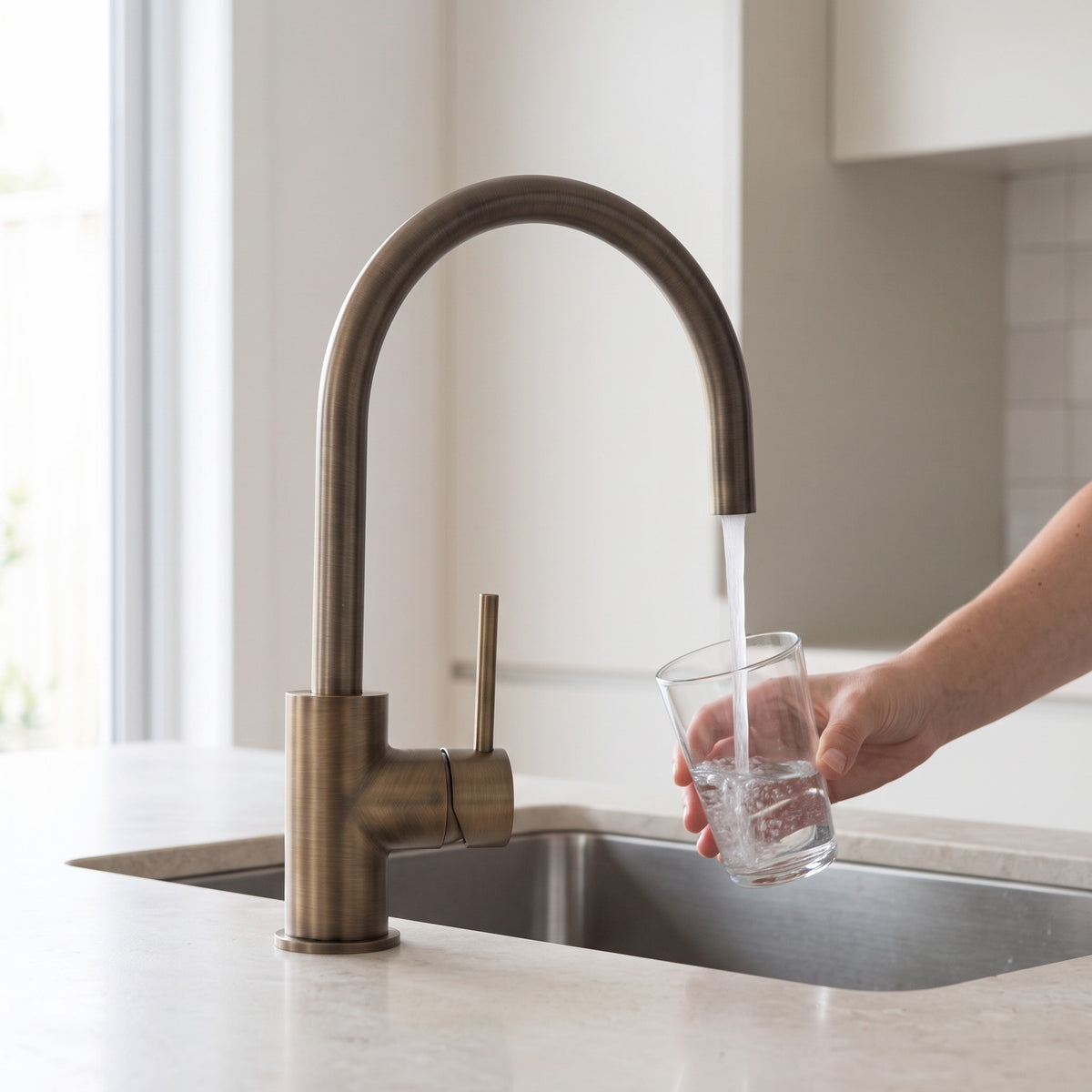 Como Kitchen Mixer Tap in Antique Brass in use in a kitchen