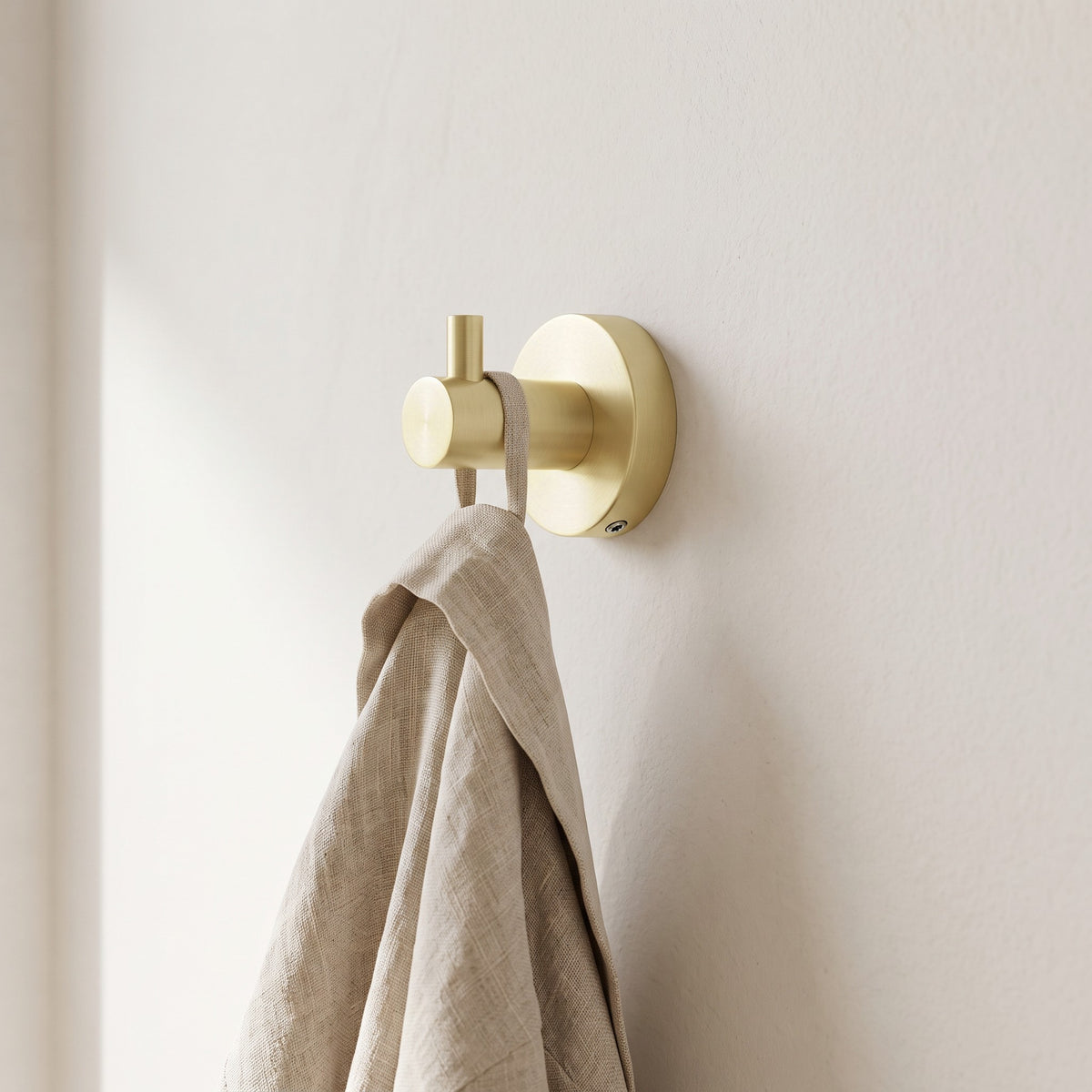 Copenhagen Robe Hook in Brushed Brass in a bathroom