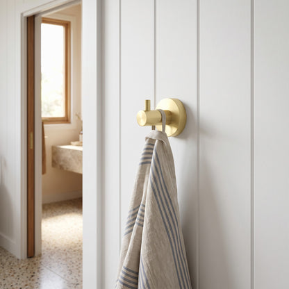 Copenhagen Robe Hook in Brushed Brass in a bathroom