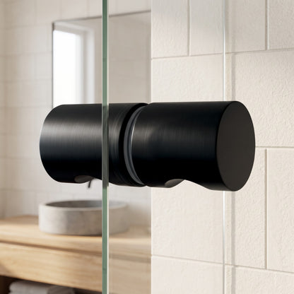 Corfu Shower Door Handle in Matte Black on a glass shower door