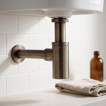 Close-up of the Firenze Basin Bottle Trap in Antique Brass