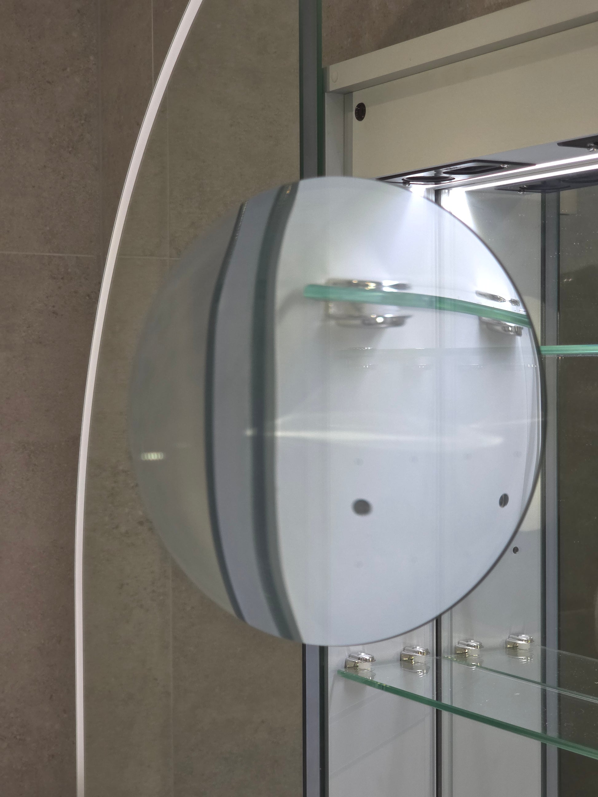 Inside view of frameless LED mirror cabinet with internal magnifier