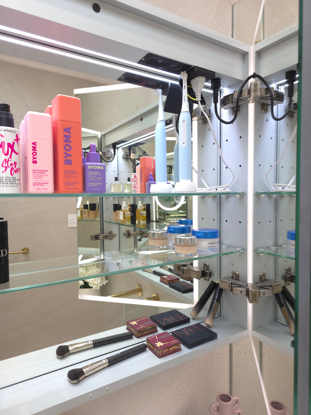Frameless LED mirror cabinet with adjustable internal glass storage shelves