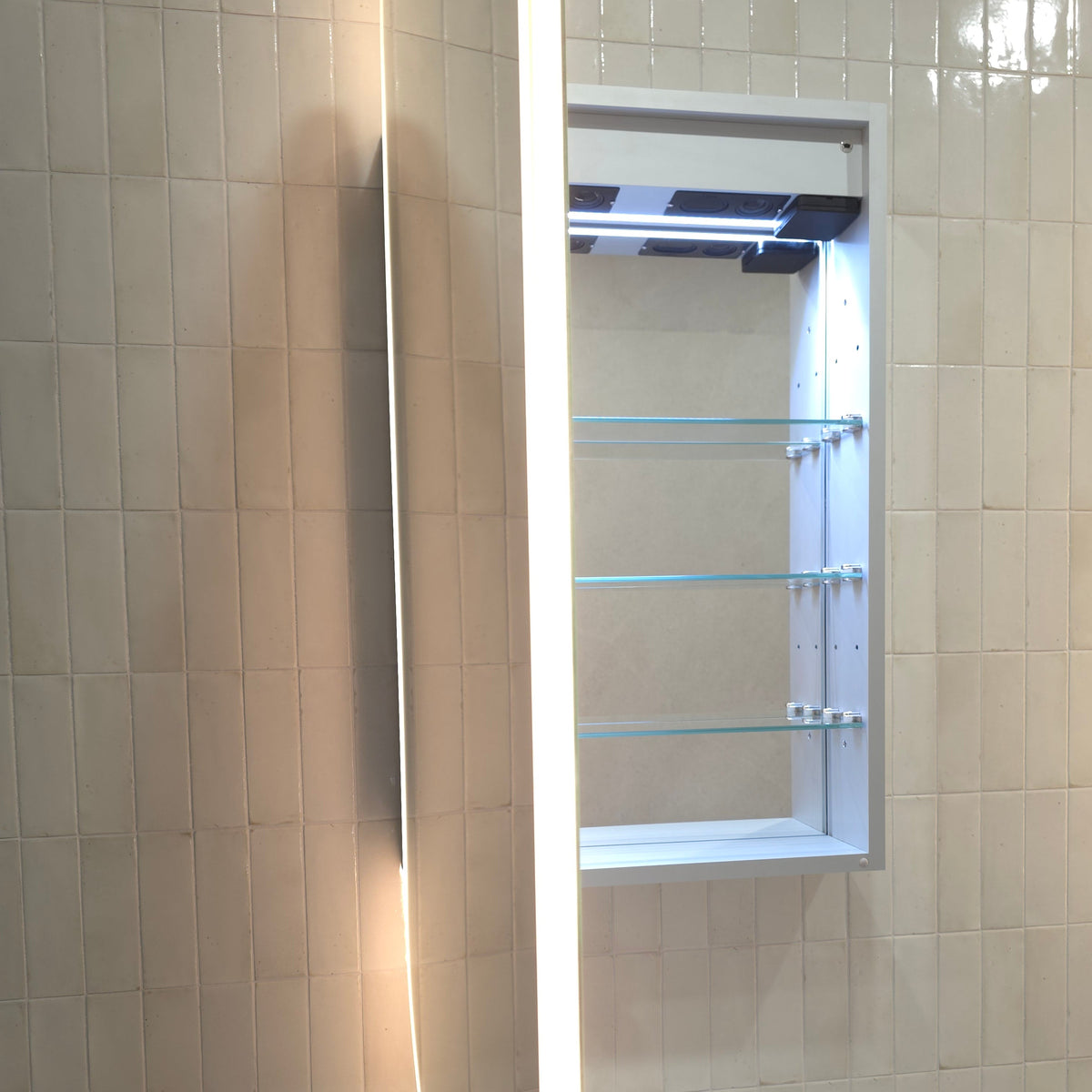 Frameless LED oval mirror cabinet with internal storage and built in powerpoint