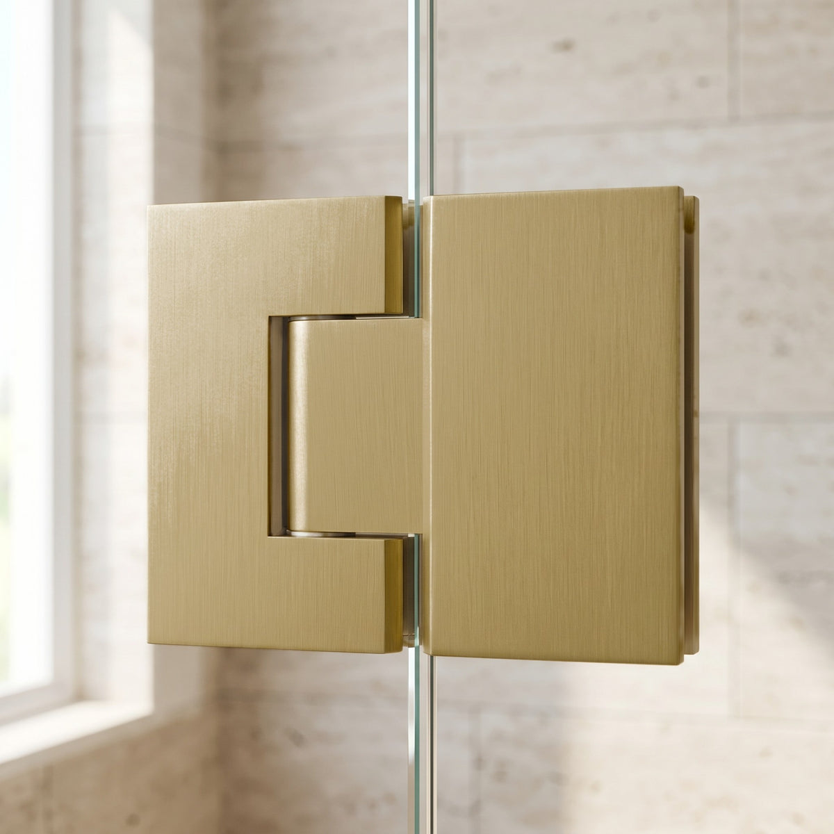 Close-up of the Geneva Shower Hinge Glass to Glass in Brushed Brass