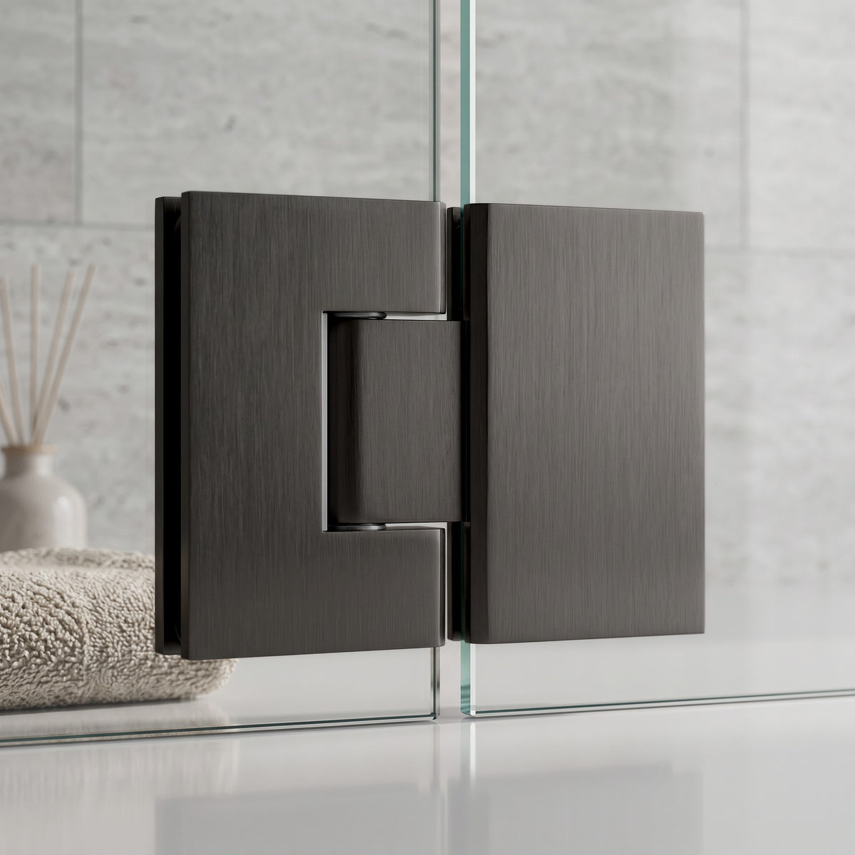 Close-up of the Geneva Shower Hinge Glass to Glass in Brushed Gunmetal