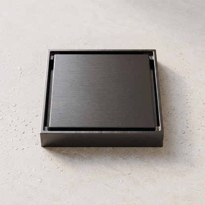 Close-up of the Granada Tile Insert Floor Waste in Brushed Gunmetal