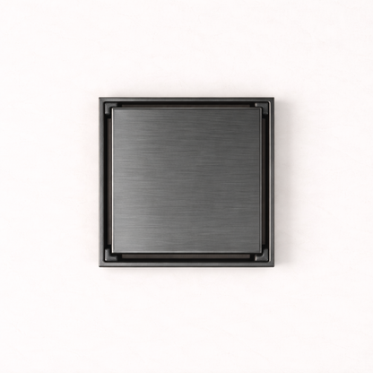 Granada Tile Insert Floor Waste in Brushed Gunmetal, top-down view of the square brushed cover on a plain white background