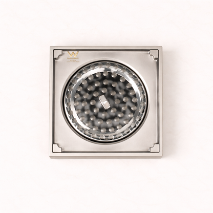 Granada Tile Insert Floor Waste in Brushed Nickel, cover removed to show the round strainer on a plain white background