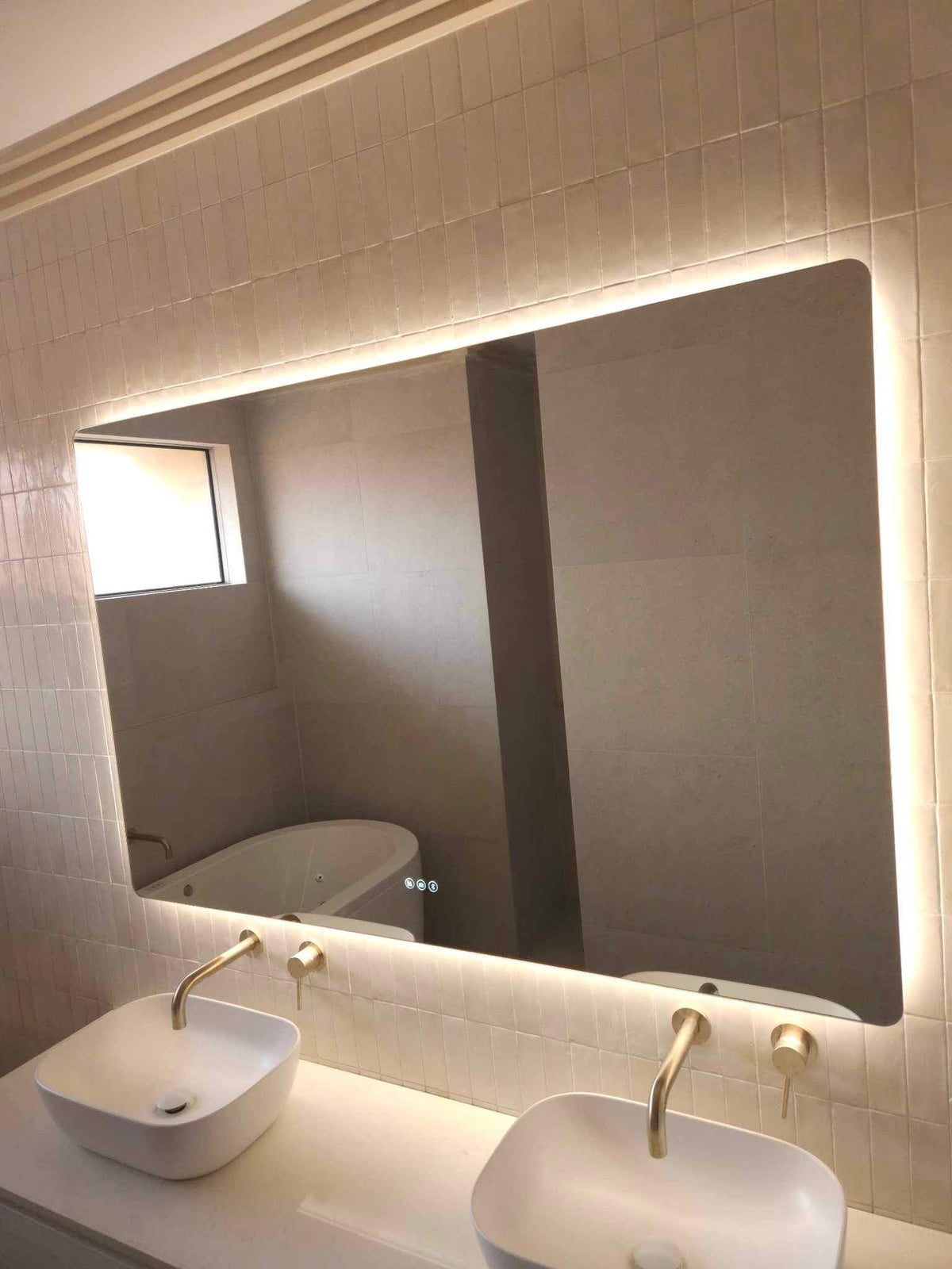 Spacious Gold, Beige, and White Themed Bathroom with Large Smart Backlit LED Mirror