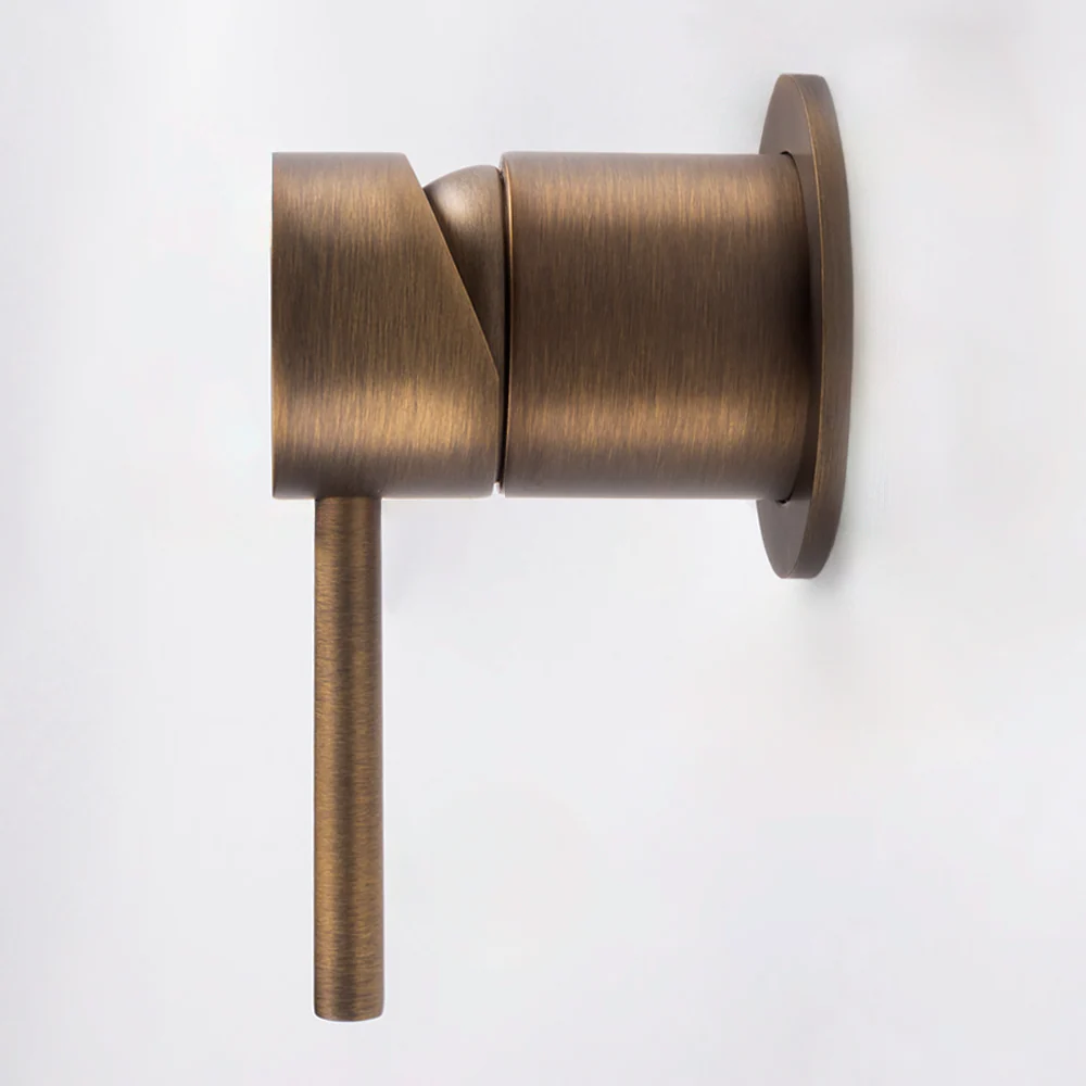 Milano Wall Mixer in Antique Brass, side profile showing the round body and lever on a plain white background