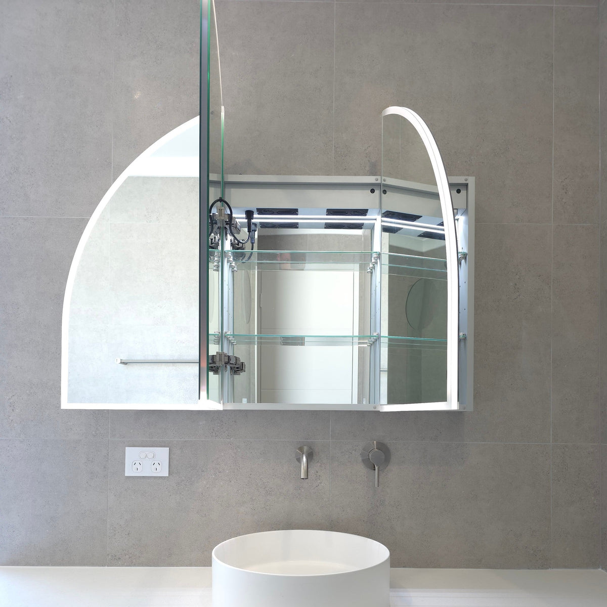 Frameless bathroom mirror cabinet showing adjustable internal shelves