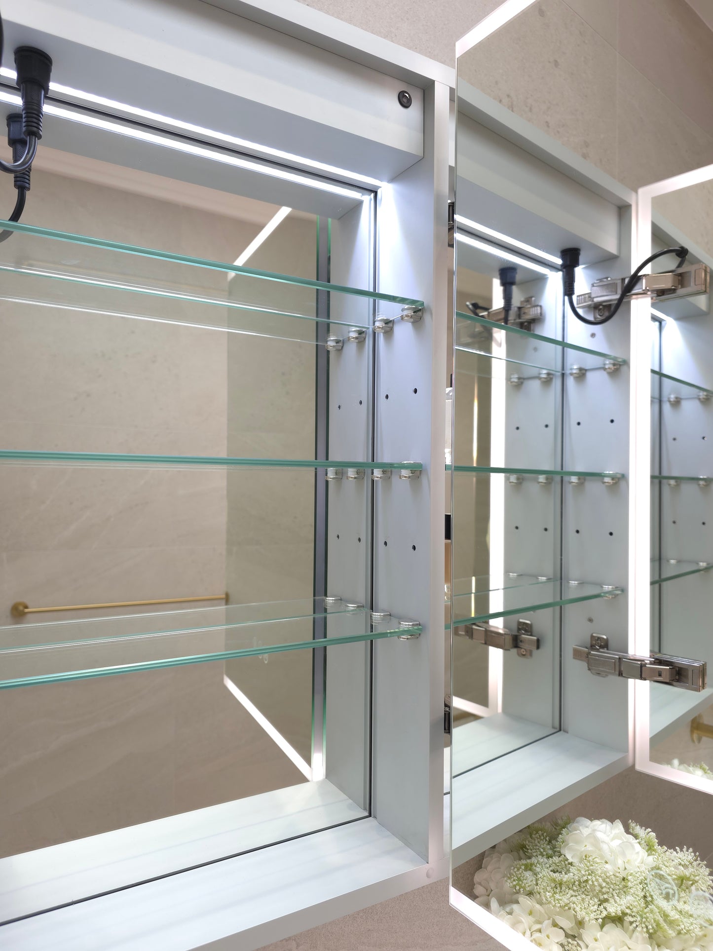 Frameless bathroom mirror cabinet showing adjustable internal shelves