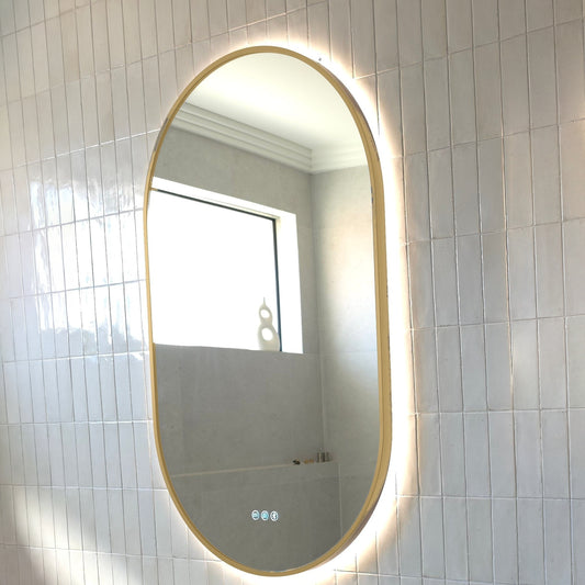 Angled view of the Marseille gold frame showing how it wraps around the edge of the glass