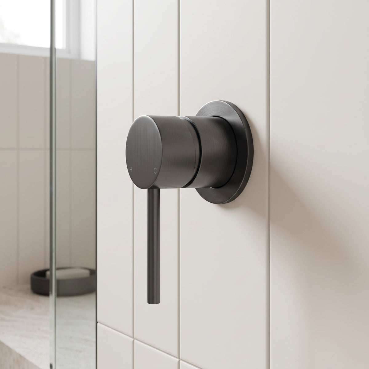 Milano Wall Mixer in Brushed Gunmetal in a bathroom