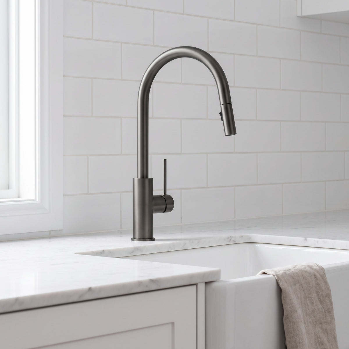 Porto Pull-Out Kitchen Mixer in Brushed Gunmetal in a kitchen