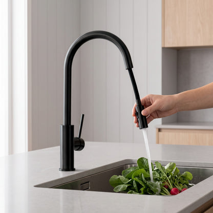Porto Pull-Out Kitchen Mixer in Matte Black in use in a kitchen