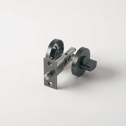 Prague Door Lock in Brushed Gunmetal, lock mechanism with latch and both roses on a plain white background