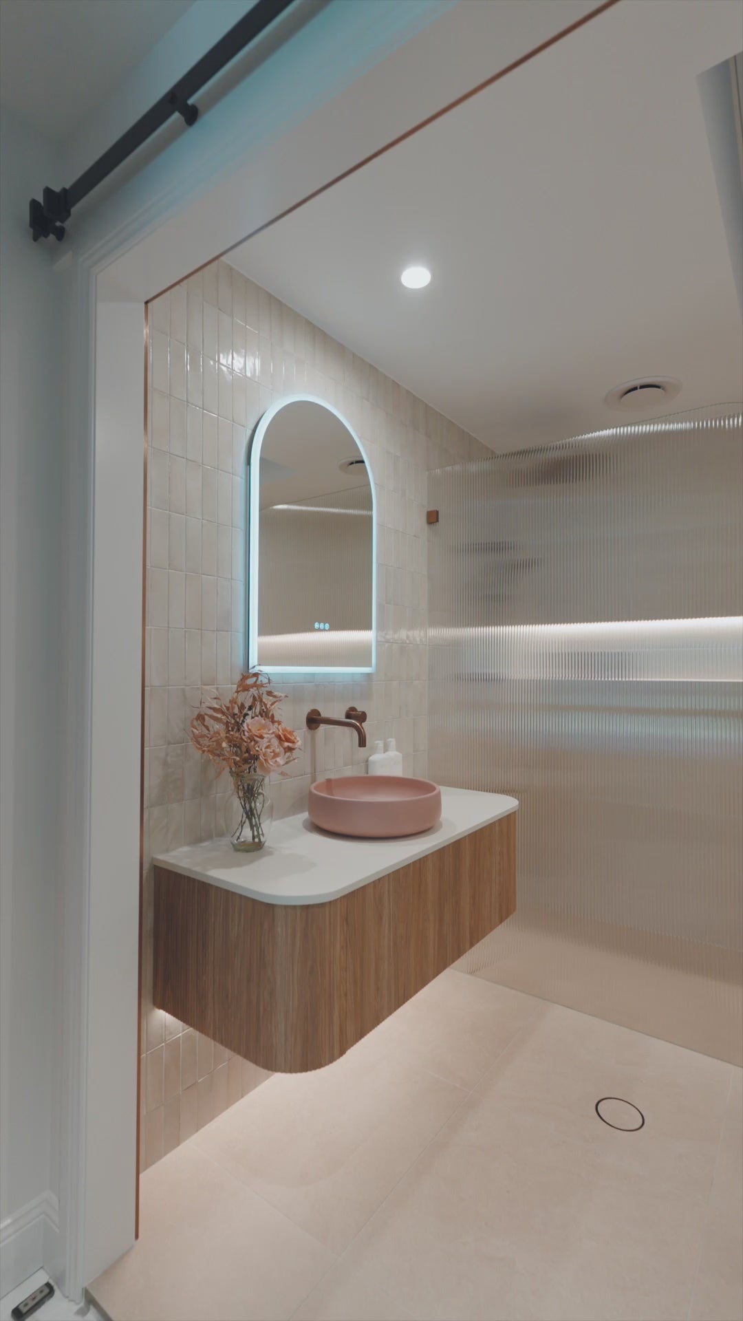 Video demonstration showing various angles of recessed arched LED mirror cabinet by Invogue