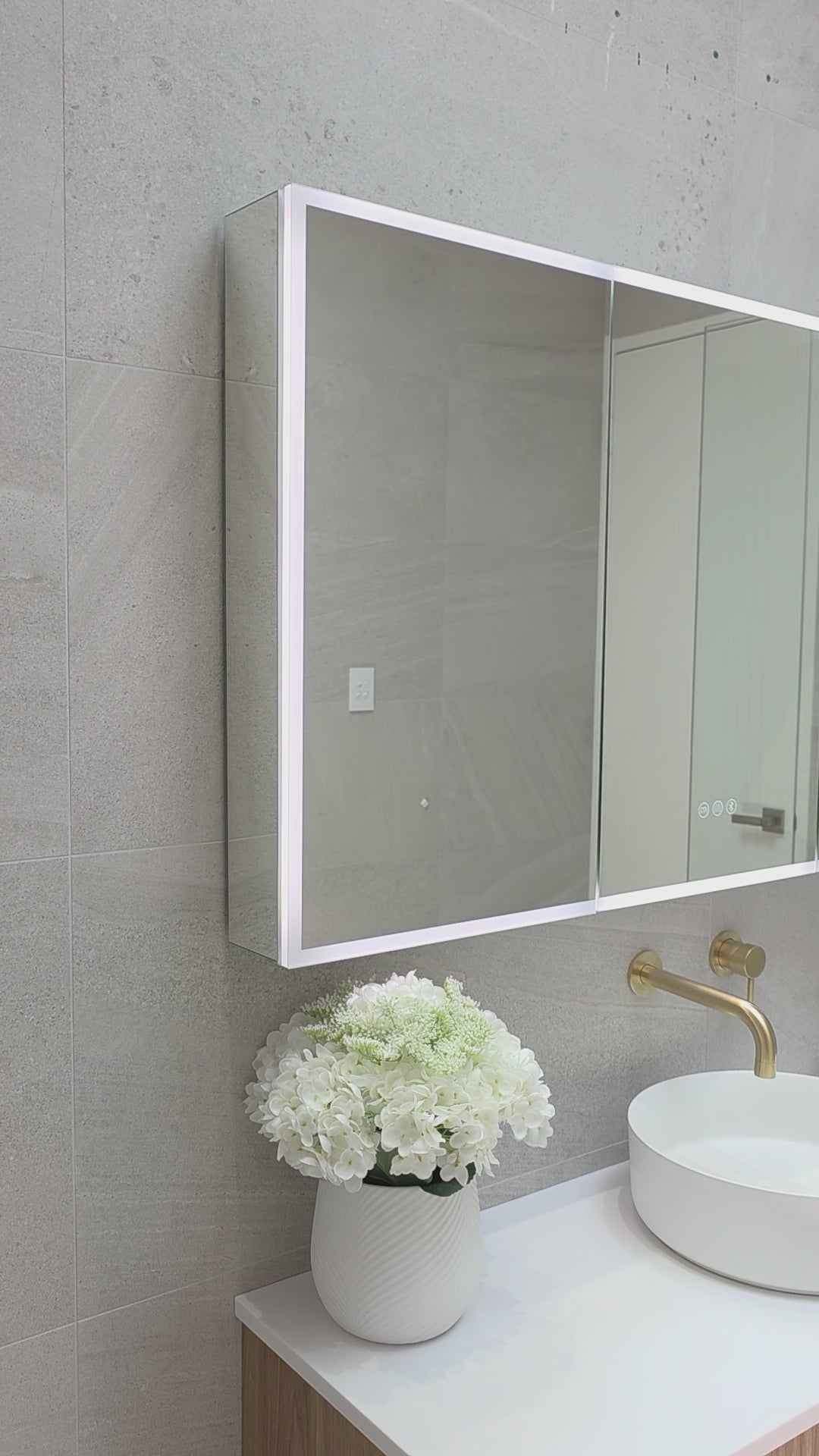 Video demonstration of the exterior lighting of frameless LED bathroom mirror cabinet by Invogue