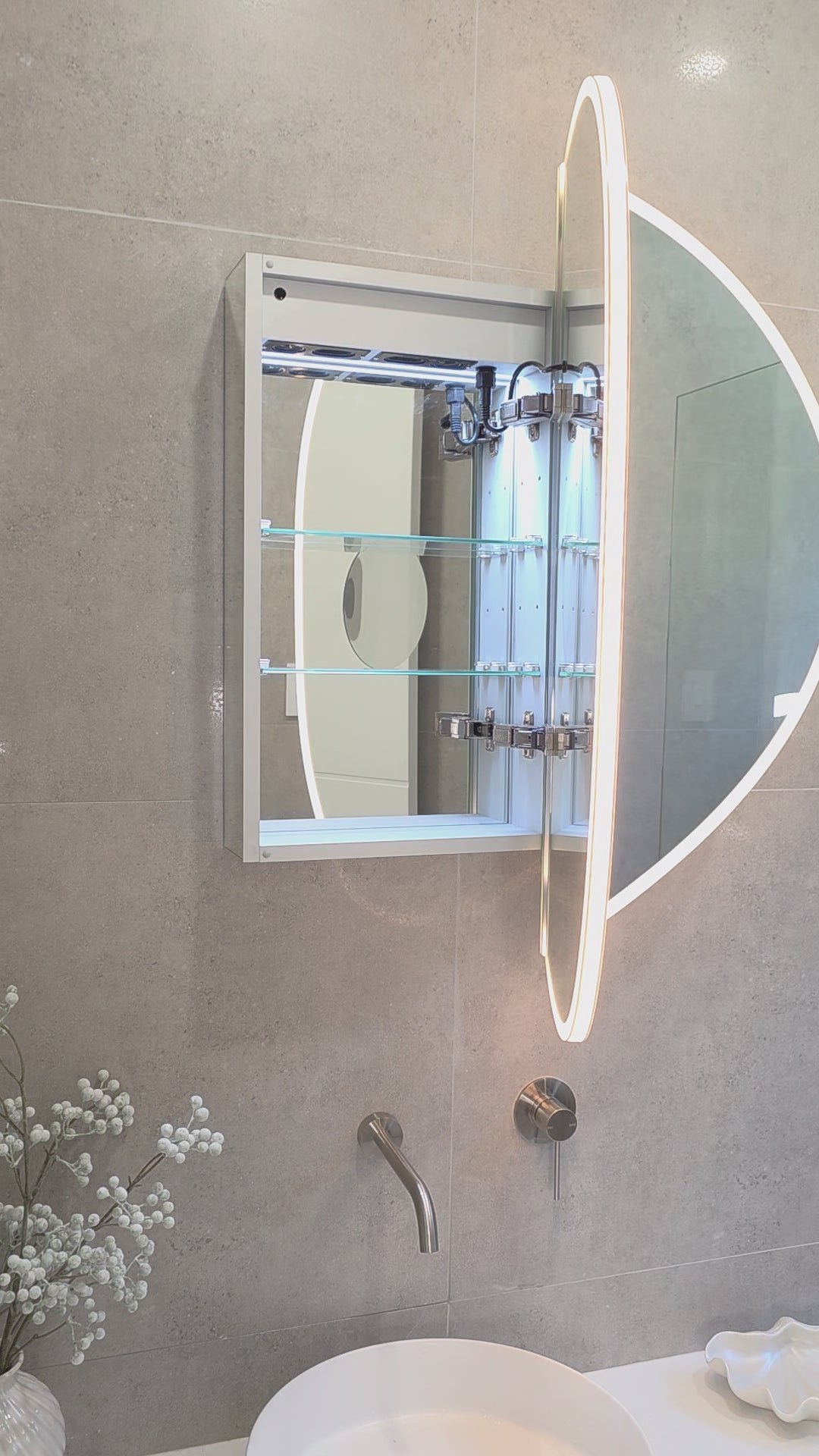 Video demonstration of internal view of internal led mirror cabinet showing bluetooth speakers and adjustable glass shelves