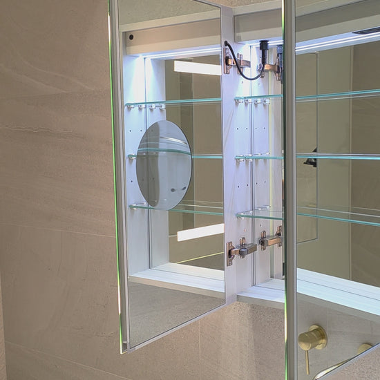 Frameless LED mirror cabinet with internal storage and built-in magnifier