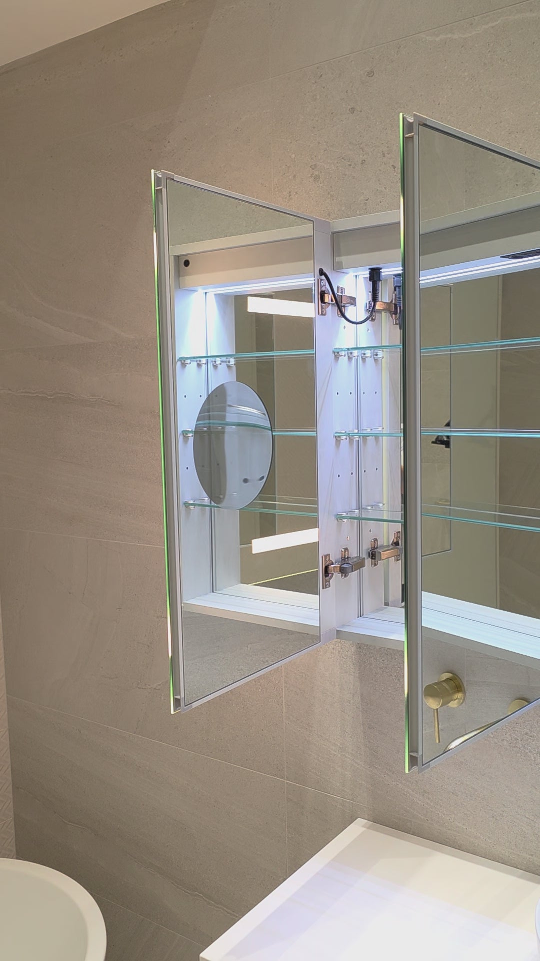 Frameless LED mirror cabinet with internal storage and built-in magnifier