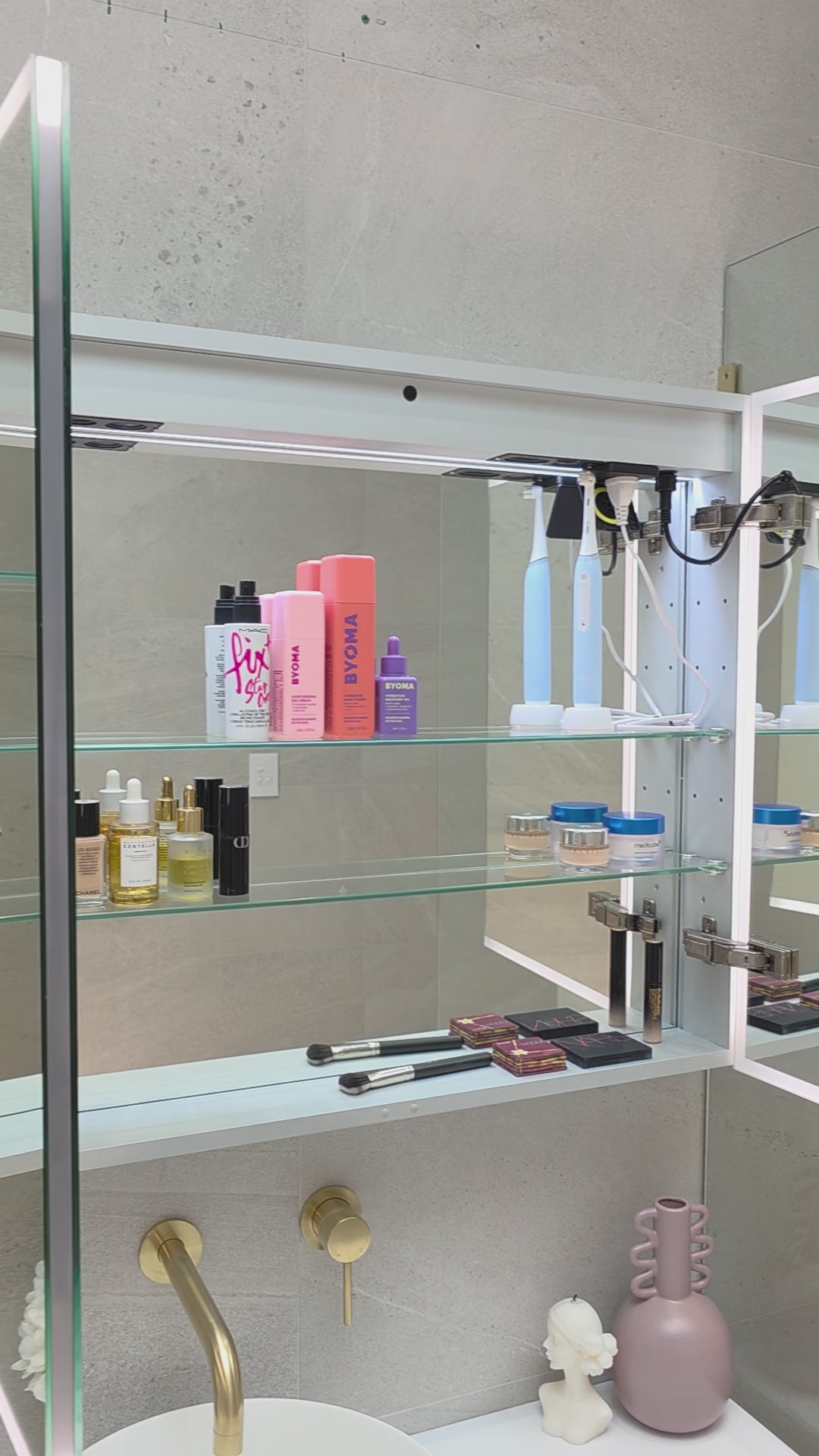 Video demonstration of frameless LED bathroom mirror cabinet showing internal ample storage with adjustable shelving