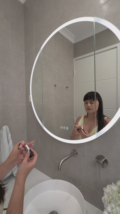 Video demonstration of frameless LED bathroom mirror cabinet showing internal storage and lighting