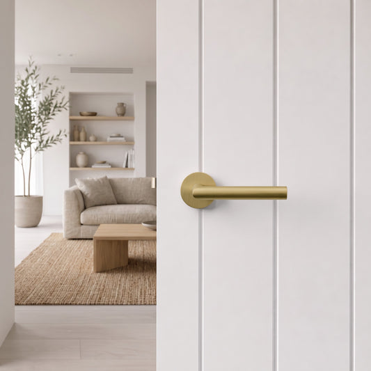 Santorini Door Handle in Brushed Brass on an interior door