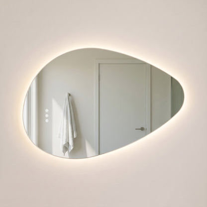 The Sorrento frameless backlit LED mirror, 800 x 550mm, three-quarter view floating off a warm-white wall with an even halo