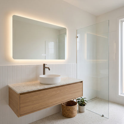 Vienna Tall Basin Mixer in Antique Brass in a bathroom