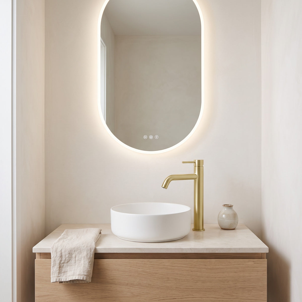 Vienna Tall Basin Mixer in Brushed Brass in a bathroom